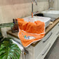 BIO-Handtuch Schildkröte lachs liegt auf Waschbecken